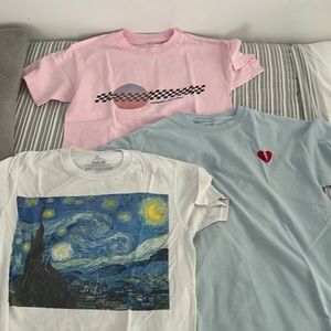 3 t-shirts 1 pink 1 blue 1 white the white has a  stain on the back